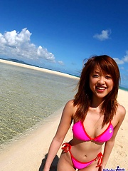 Asian babe Asuka shows off her great tits in the sun