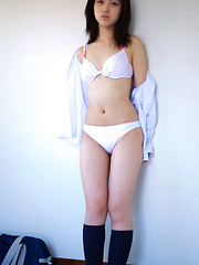 Azusa Togashi Asian undresses uniform to show behind in panty